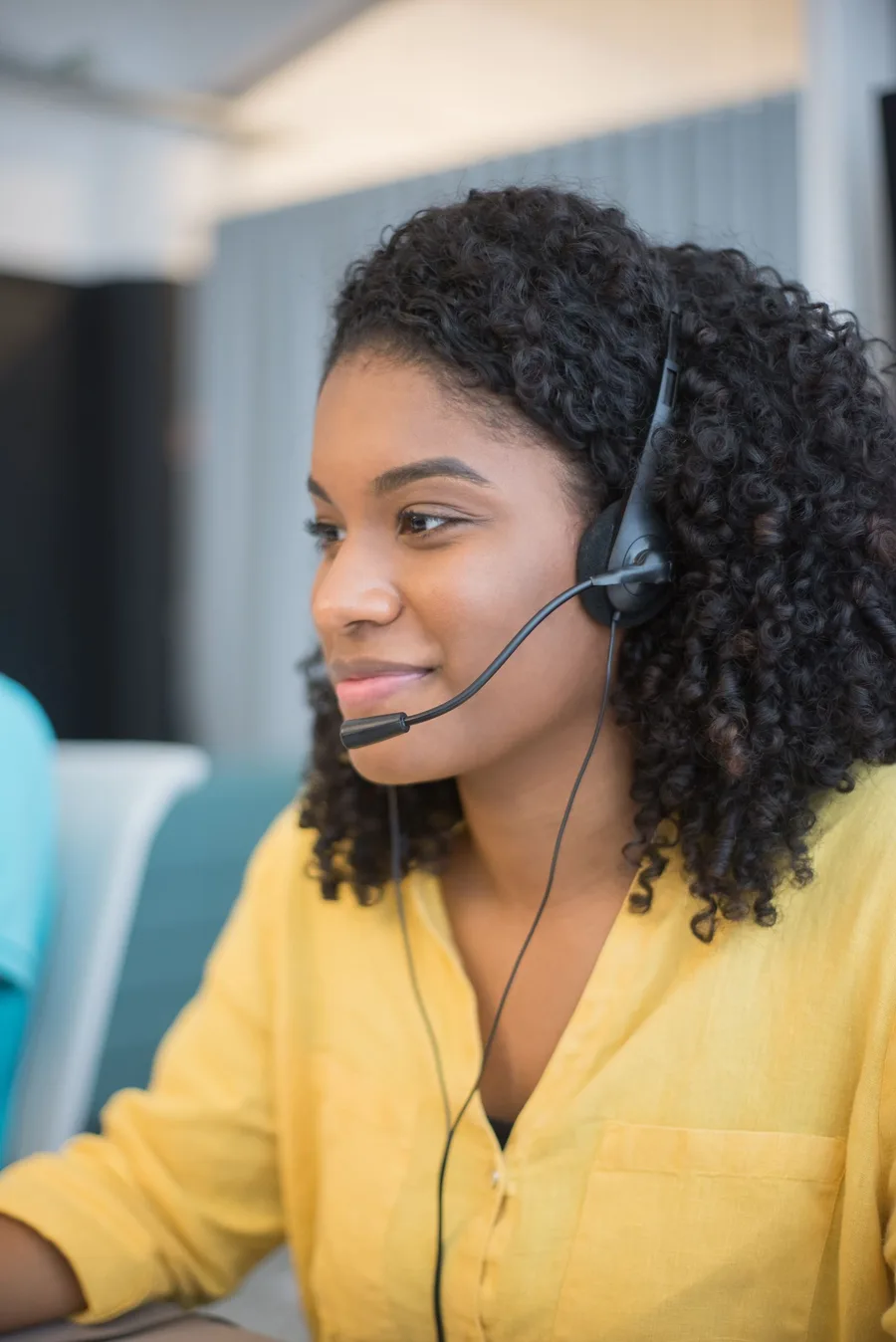 Torqen England support advisor on a headset call